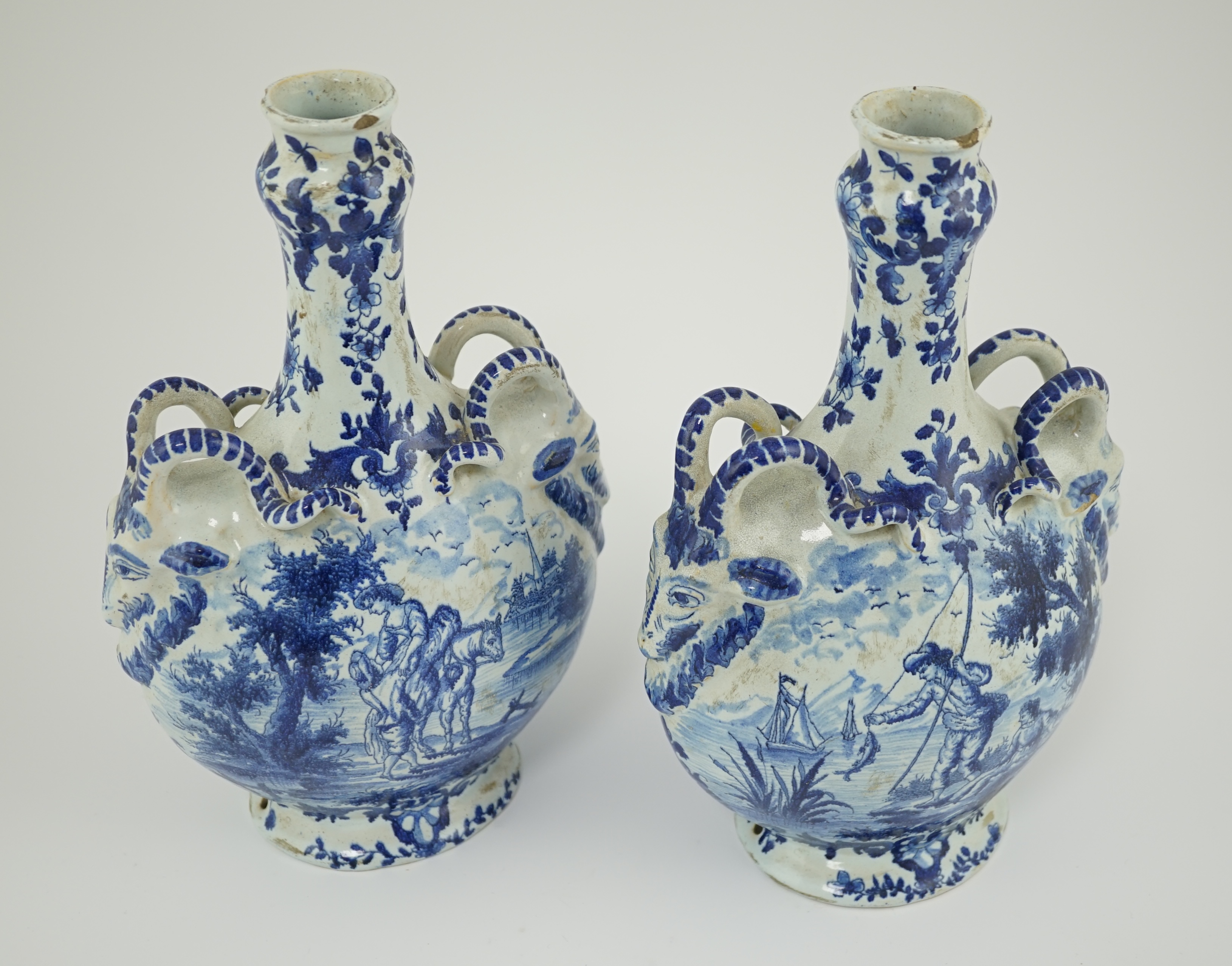 A pair of mid 18th century Delft blue and white flagons